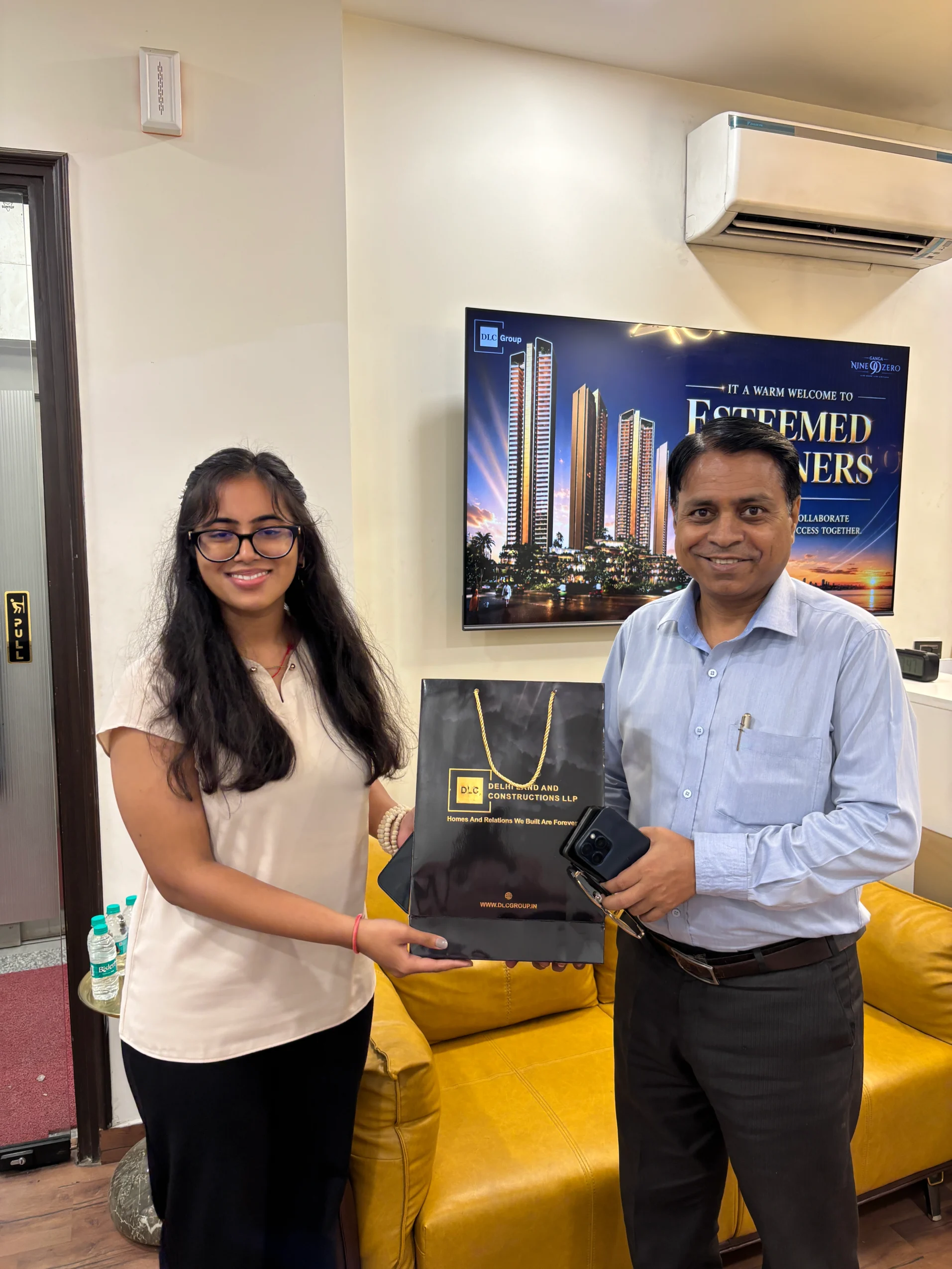 DLC Group presenting gifts to event attendees